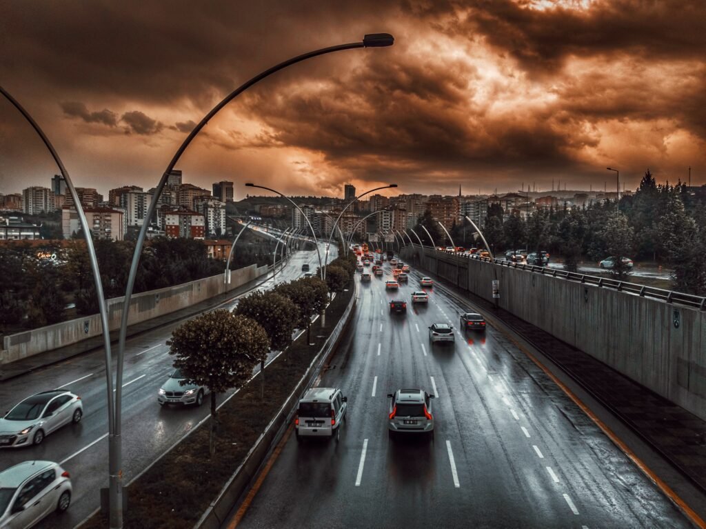 road under brown and black sky during daytime